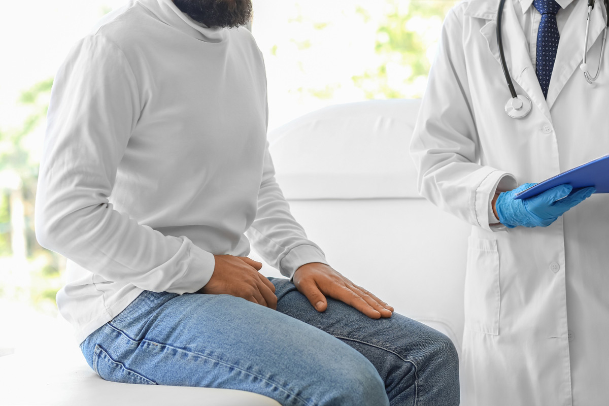 man getting kidneys checked by doctor